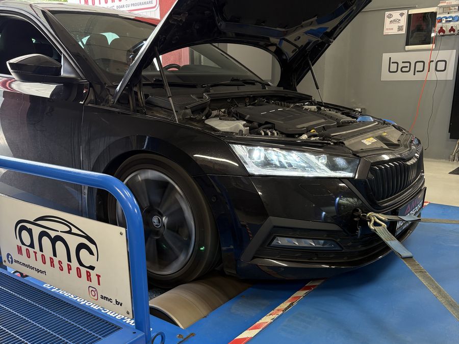 Black Skoda with the bonnet open on the dyno