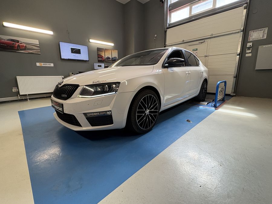 White Skoda Octavia in the AMC Motorsport workshop